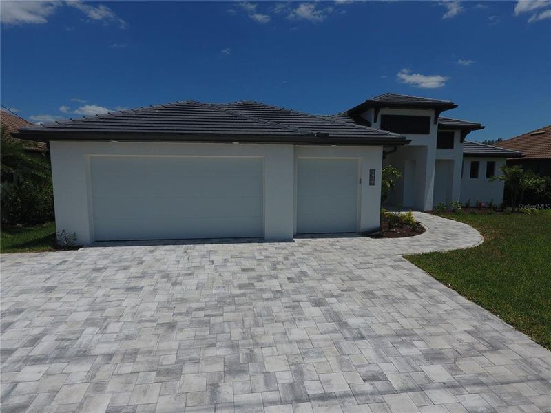 Front exterior of a new home in , Port Charlotte, FL, highlighting curb appeal (Image 24).
