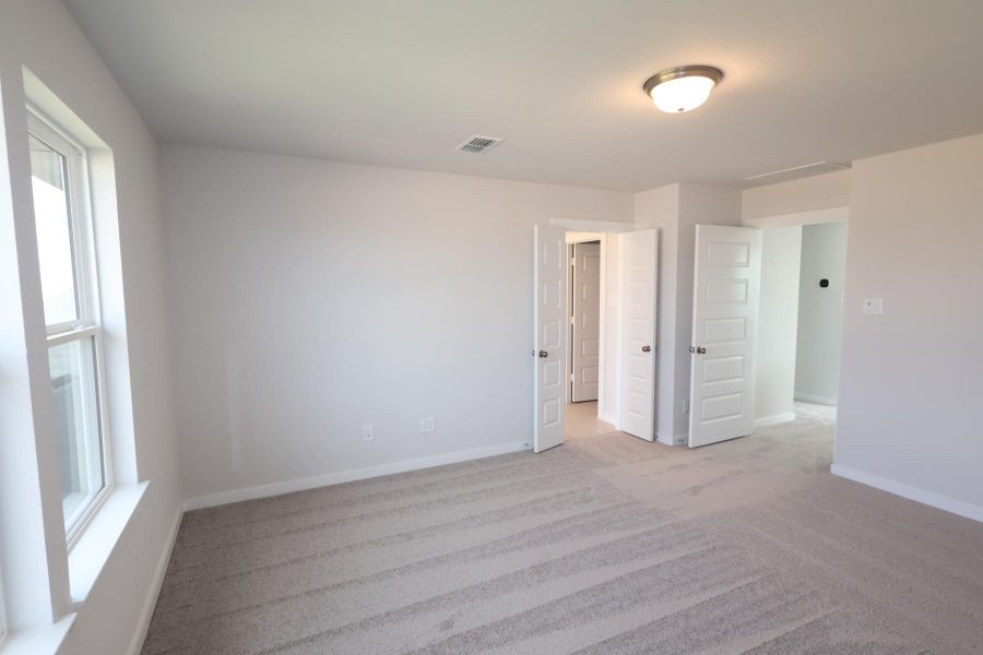 Spacious, unfurnished interior of a new home in The Cove at Mason Woods, Cypress (Image 17).