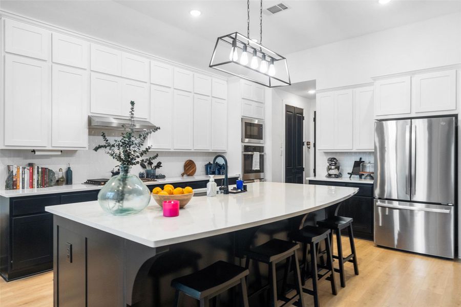Take a look at the UPGRADED EXTENDED cabinets leading to the ceiling!! That equals LOTS of storage!! Another view of the Breakfast Bar.