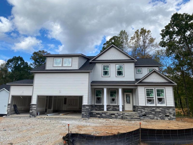Front exterior of a new home in Laneridge Estates, Raleigh, NC, highlighting curb appeal (Image 2).