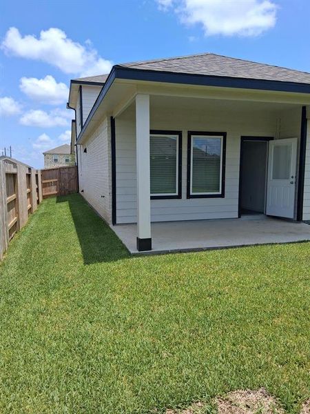 Front exterior of a new home in Windrose Green, Angleton, TX, highlighting curb appeal (Image 23). Front exterior of a new home in Windrose Green, Angleton, TX, highlighting curb appeal (Image 23).