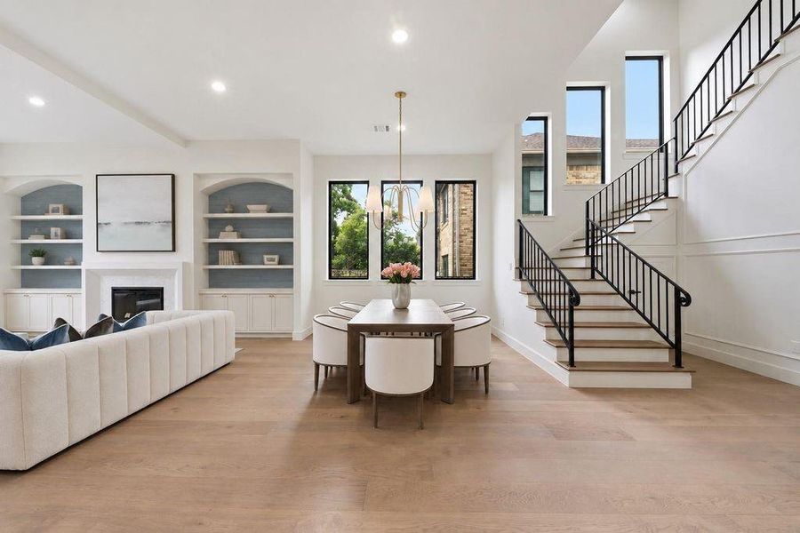 Dinning room with nightlines into the living room and grand staircase