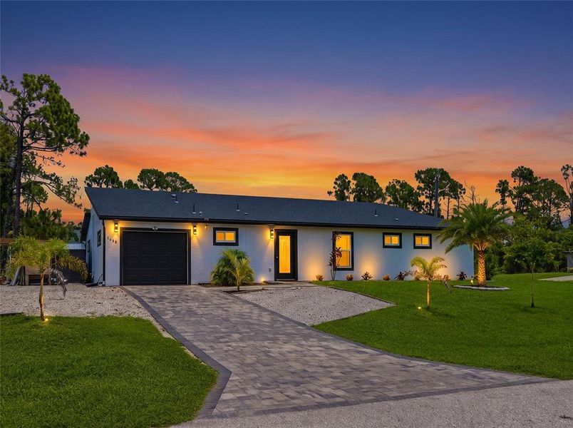 Front exterior of a new home in , North Port, FL, highlighting curb appeal (Image 26). Front exterior of a new home in , North Port, FL, highlighting curb appeal (Image 26).