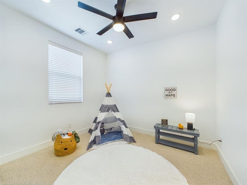 Secondary bedroom on the third floor.