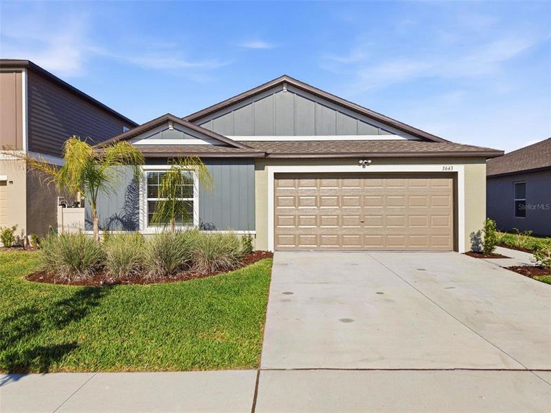 Front exterior of a new home in North Park Isle, Plant City, FL, highlighting curb appeal (Image 22).