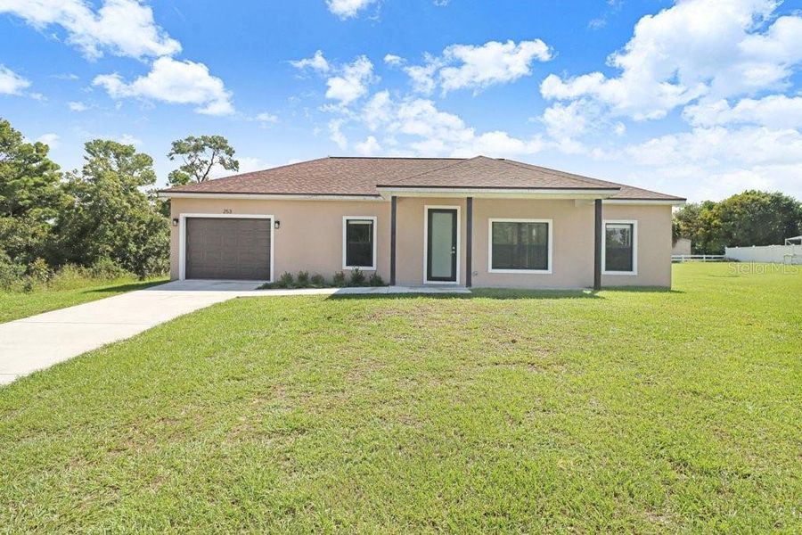 Front exterior of a new home in , Lake Placid, FL, highlighting curb appeal (Image 15). Front exterior of a new home in , Lake Placid, FL, highlighting curb appeal (Image 15).