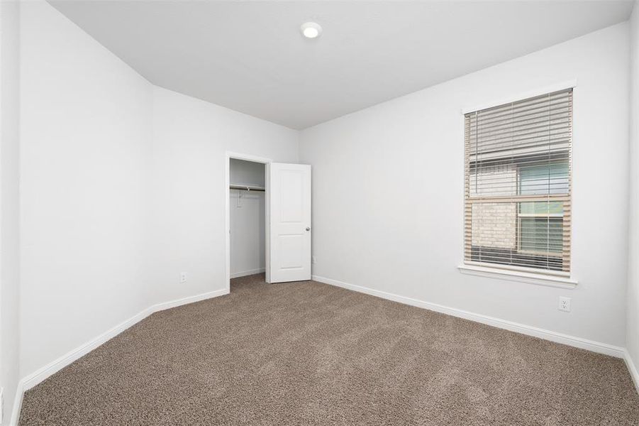 Unfurnished bedroom featuring carpet flooring