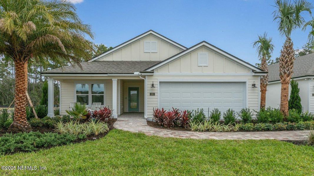 Front exterior of a new home in American Village, Palm Coast, FL, highlighting curb appeal (Image 20).