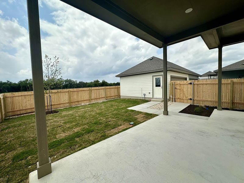 Front exterior of a new home in Sage Hollow, Kyle, TX, highlighting curb appeal (Image 22).