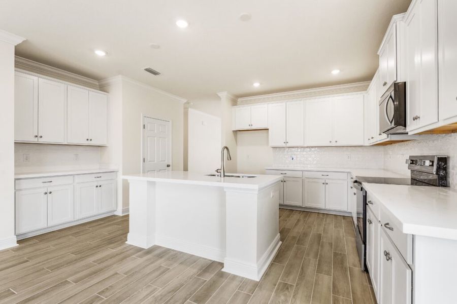 Furnished interior view inside a new home in Natureview, Freeport (Image 9).