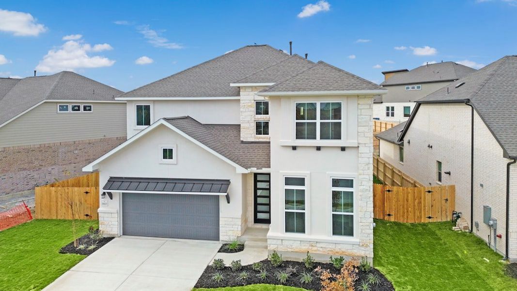 Front exterior of a new home in Blackhawk, Pflugerville, TX, highlighting curb appeal (Image 20).