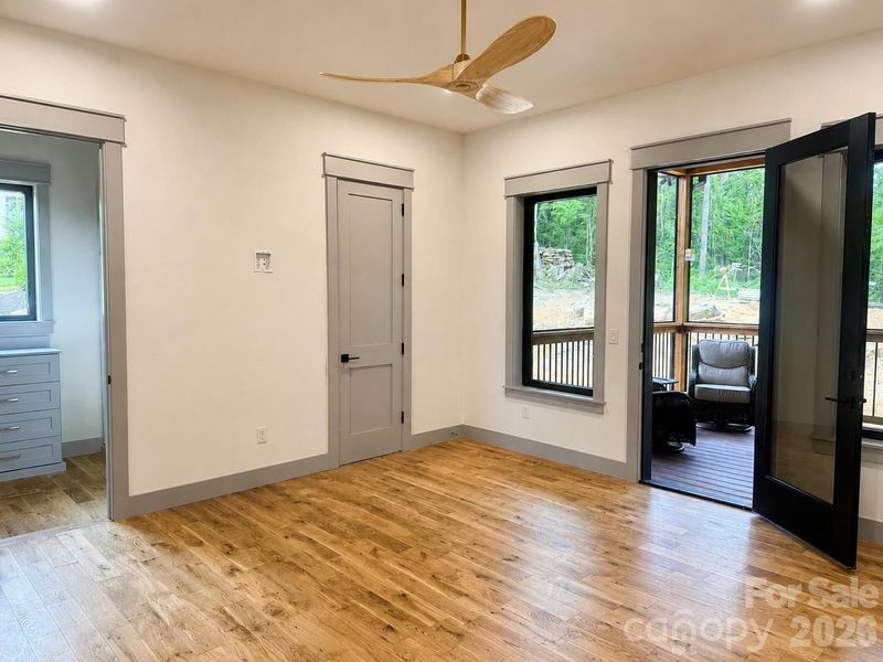 Main-level primary suite with private access to the screened porch