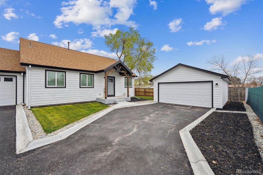Front exterior of a new home in , Lakewood, CO, highlighting curb appeal (Image 21).