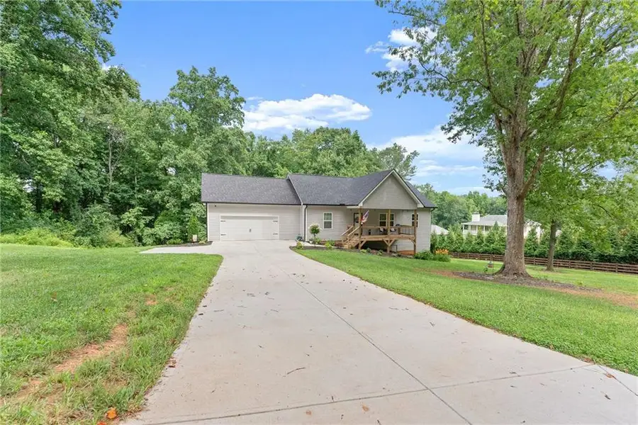 Front exterior of a new home in , Cumming, GA, highlighting curb appeal (Image 21). Front exterior of a new home in , Cumming, GA, highlighting curb appeal (Image 21).