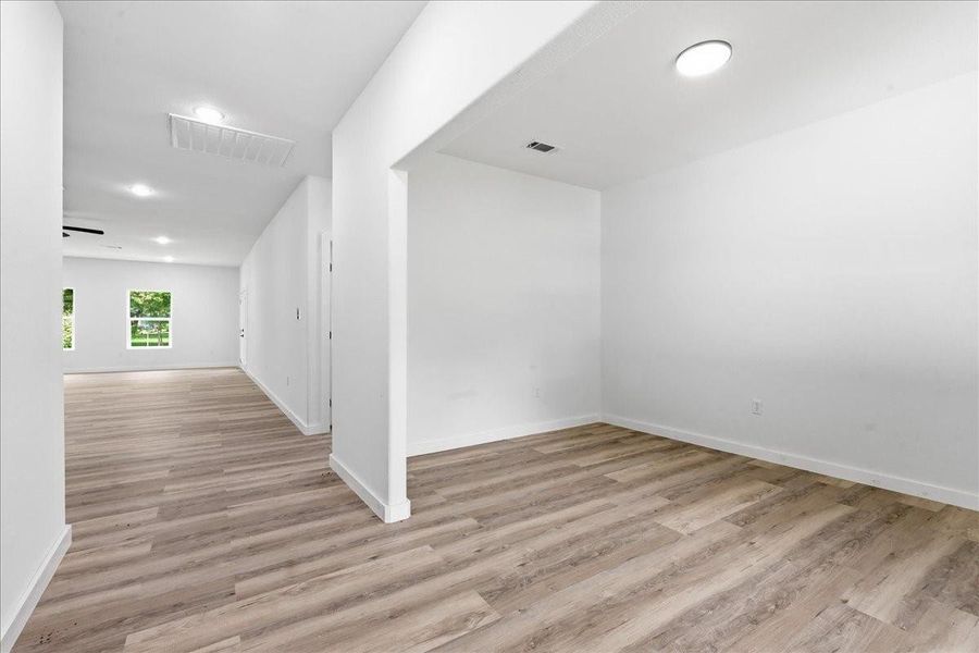 A versatile flex room or formal dining area just off the entryway, ideal for an office space. A versatile flex room or formal dining area just off the entryway, ideal for an office space.
