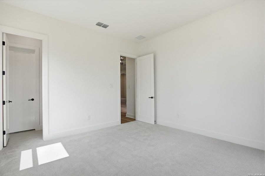Spacious, unfurnished interior of a new home in Enchanted Bluff, San Antonio (Image 46).