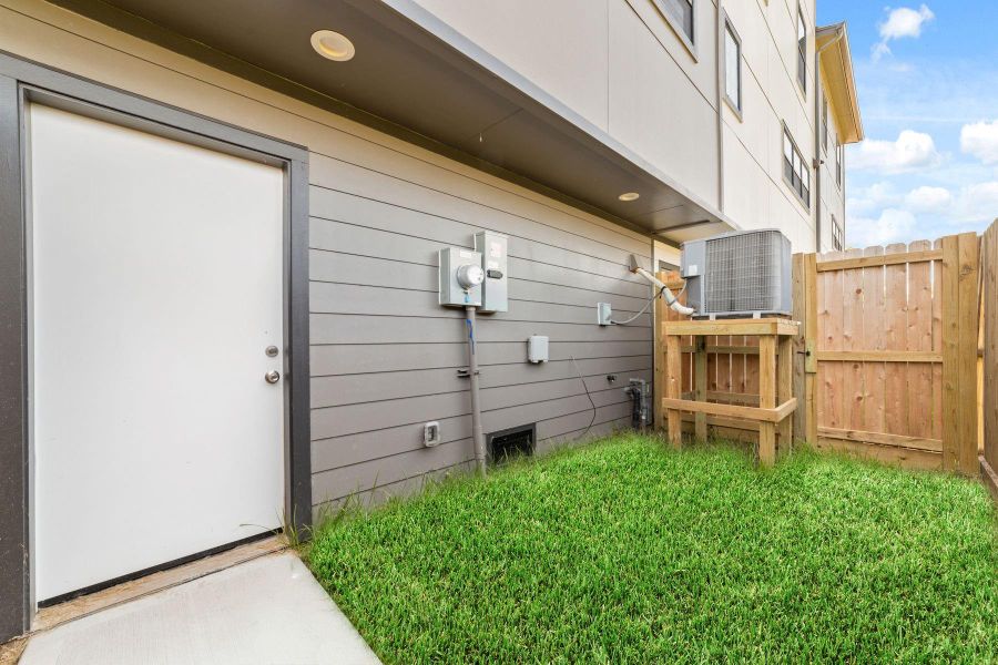 Exterior details and patio area of a home in , Houston (Image 2). Exterior details and patio area of a home in , Houston (Image 2).