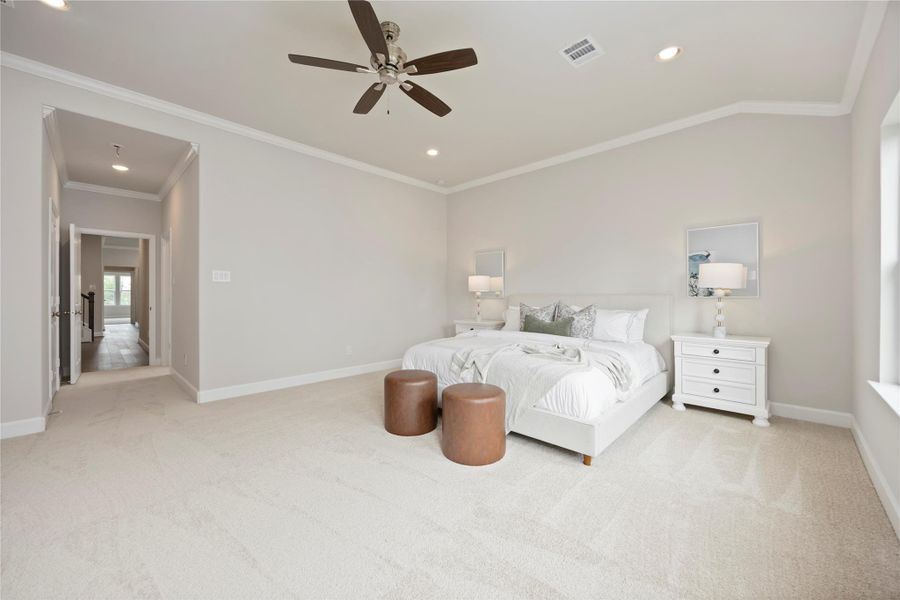 Envision a cozy seating area, Internet-ready, where relaxation meets connectivity, against the backdrop of the primary bedroom's gracious layout.