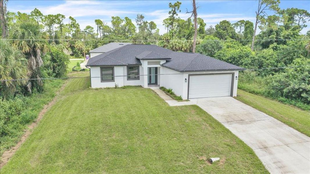 Front exterior of a new home in , Port Charlotte, FL, highlighting curb appeal (Image 23).