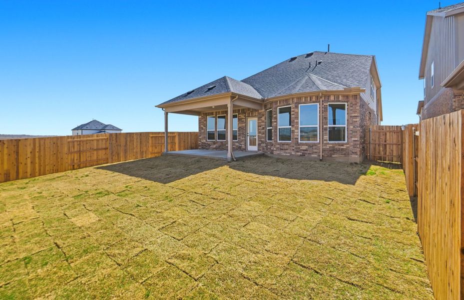 Exterior details and patio area of a home in Sunfield, Buda (Image 31).