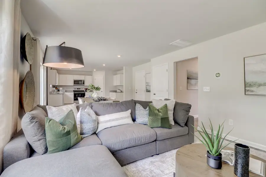 A living room with a couch and a table.