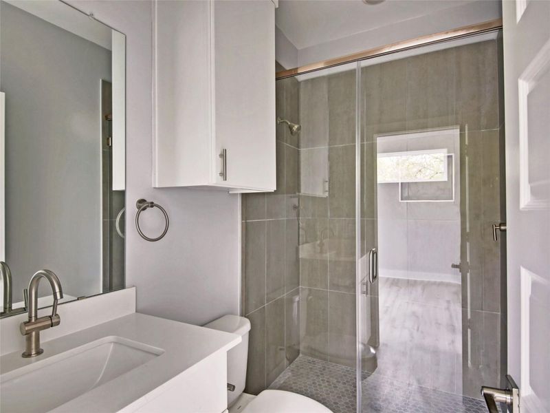 Full bathroom featuring vanity and a stall shower