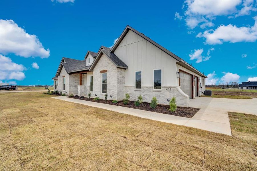 Front exterior of a new home in , Waxahachie, TX, highlighting curb appeal (Image 18).