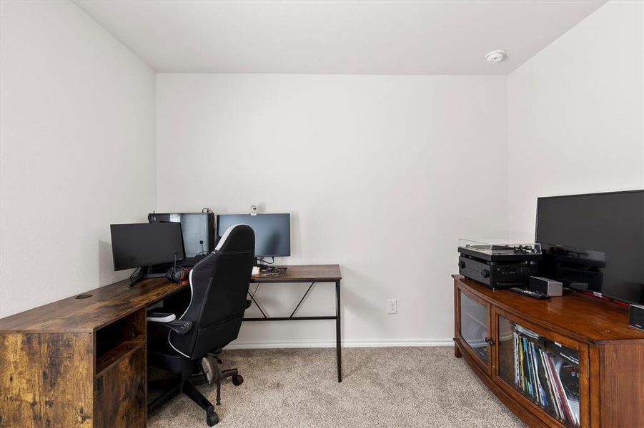 Home office with light colored carpet and baseboards Home office with light colored carpet and baseboards