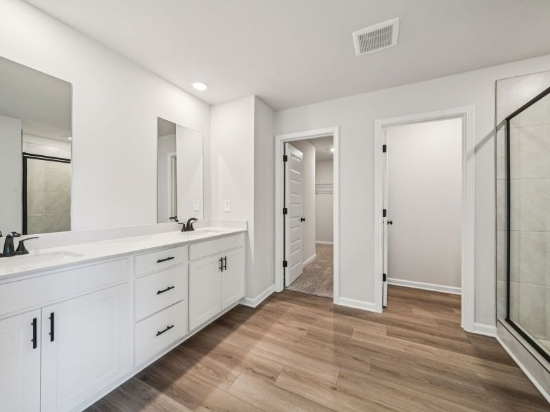 Furnished interior view inside a new home in Vines at Mill Creek - Estate Series, Braselton (Image 9).