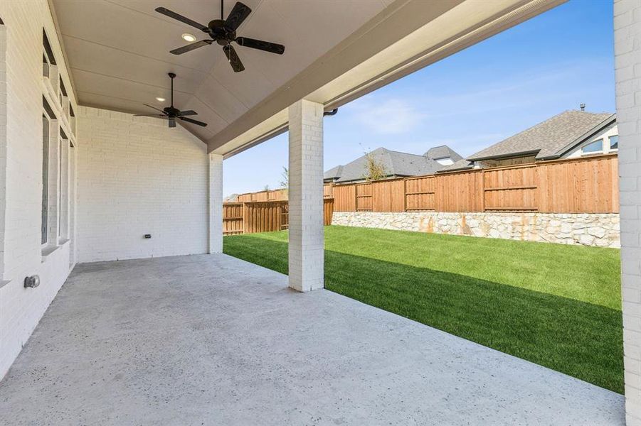 It's easy to take the party outside to this oversized covered back patio!