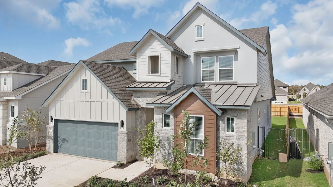 Front exterior of a new home in Lariat, Liberty Hill, TX, highlighting curb appeal (Image 17).