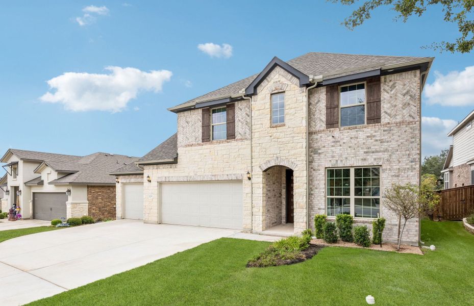 Front exterior of a new home in Crescent Bluff, Georgetown, TX, highlighting curb appeal (Image 20).