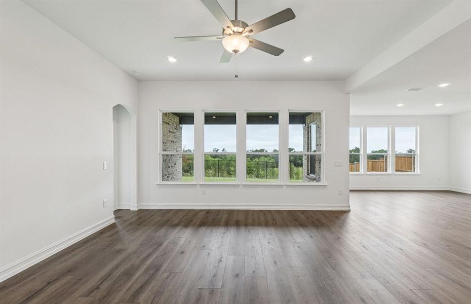 Gathering room drenched in natural light, creating a warm atmosphere  *Real home pictured