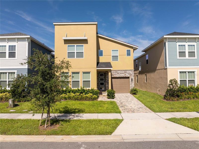 Front exterior of a new home in , Kissimmee, FL, highlighting curb appeal (Image 20).