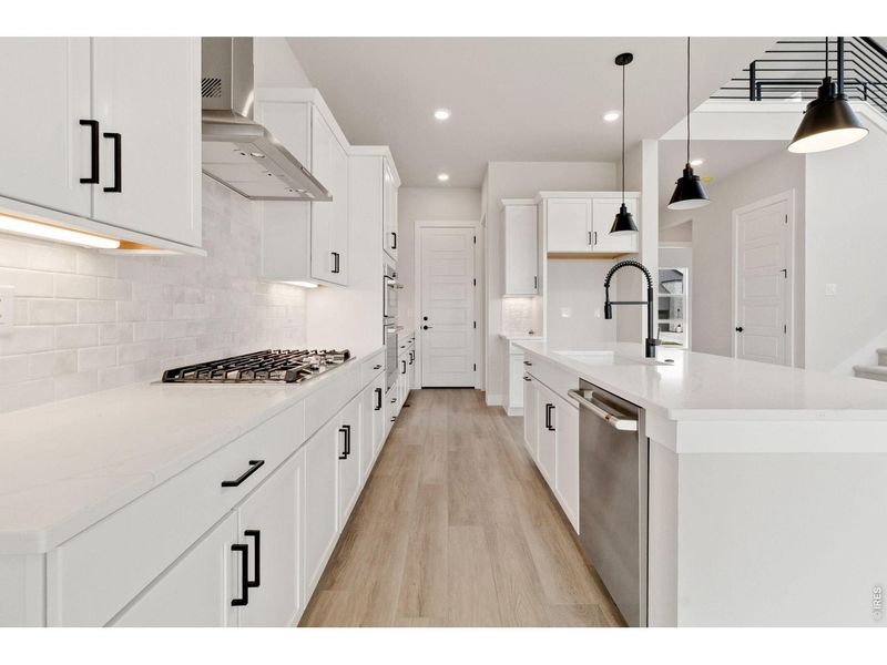 Furnished interior view inside a new home in RainDance, Windsor (Image 7).