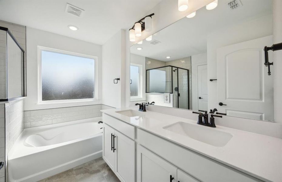 Owner's bathroom with dual vanity  *real home pictured