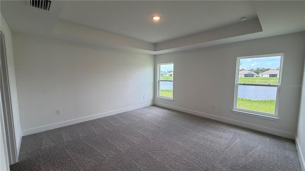 Spacious, unfurnished interior of a new home in Watercress Cove, North Port (Image 9).