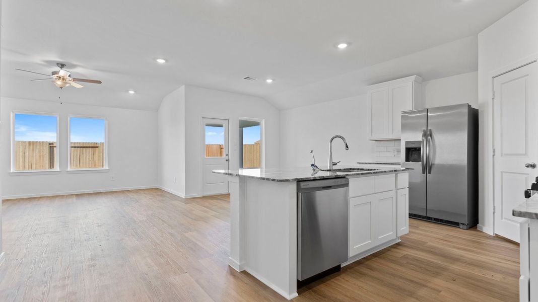 Furnished interior view inside a new home in Caldwell Crossing, Iowa Colony (Image 4).