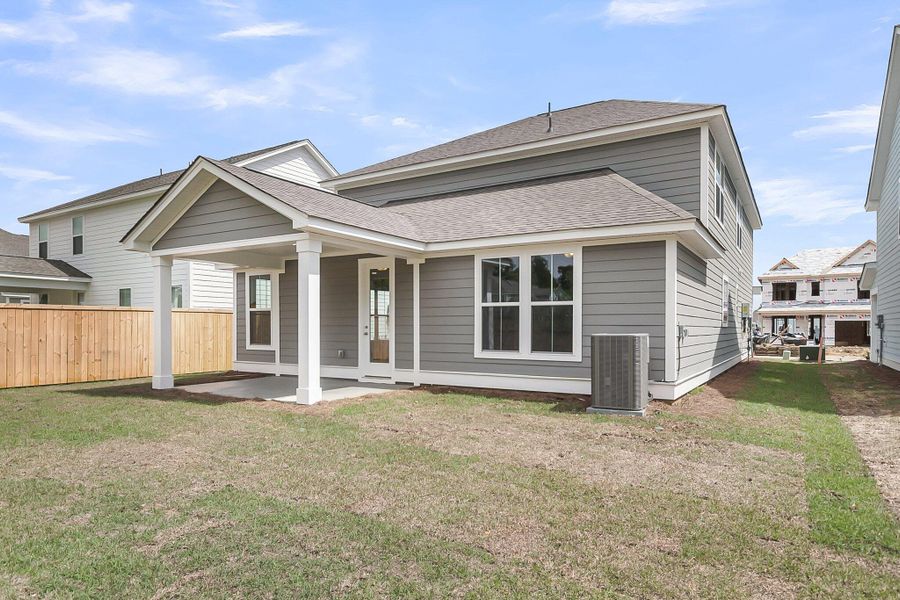 Front exterior of a new home in High Point at Foxbank, Moncks Corner, SC, highlighting curb appeal (Image 23). Front exterior of a new home in High Point at Foxbank, Moncks Corner, SC, highlighting curb appeal (Image 23).