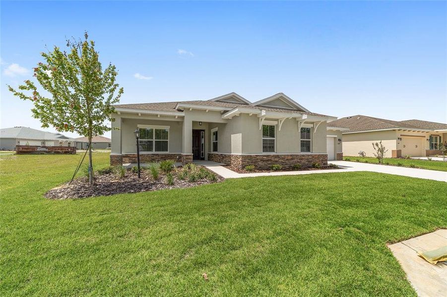 Front exterior of a new home in On Top of the World Communities, Ocala, FL, highlighting curb appeal (Image 19).