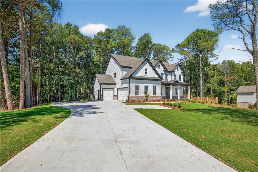 Front exterior of a new home in , Cumming, GA, highlighting curb appeal (Image 1). Front exterior of a new home in , Cumming, GA, highlighting curb appeal (Image 1).