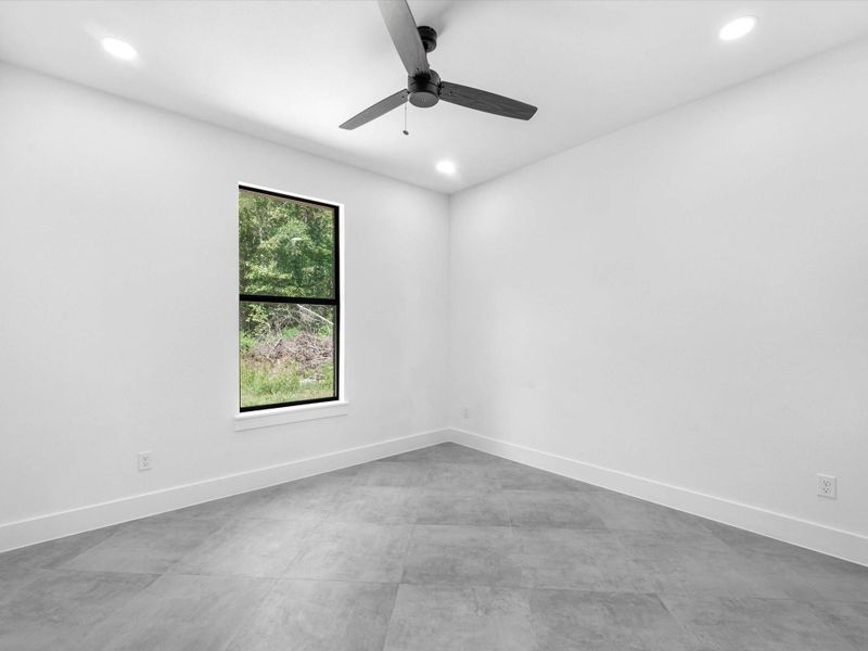 third bedroom with a view to the backyard