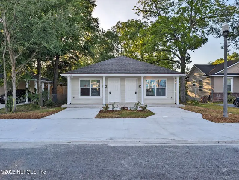 Front exterior of a new home in , Jacksonville, FL, highlighting curb appeal (Image 1). Front exterior of a new home in , Jacksonville, FL, highlighting curb appeal (Image 1).