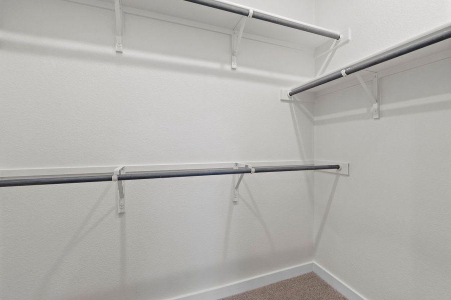 Primary Closet in the Pearl home plan by Trophy Signature Homes – REPRESENTATIVE PHOTO Primary Closet in the Pearl home plan by Trophy Signature Homes – REPRESENTATIVE PHOTO