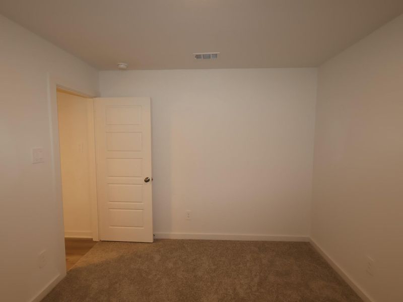 Spacious, unfurnished interior of a new home in Pinewood at Grand Texas, New Caney (Image 24).