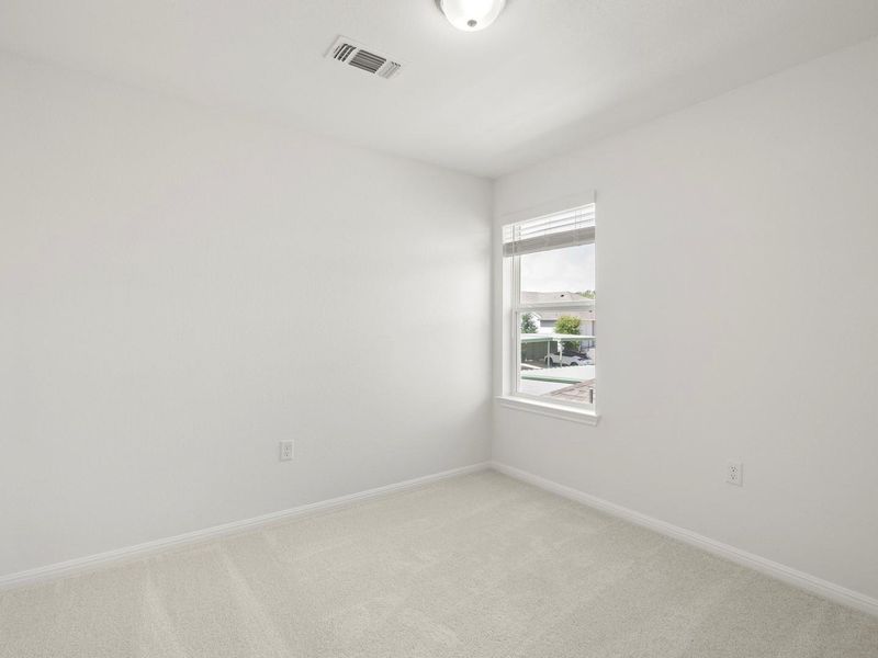A well-lit room awaits your personal touch, offering comfort and versatility.
