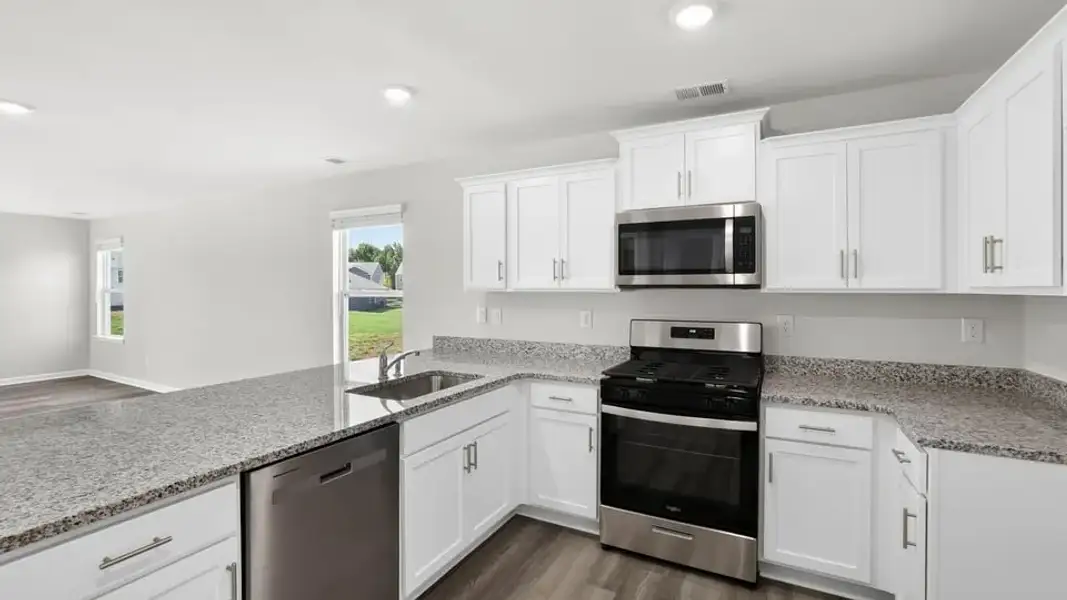 Furnished interior view inside a new home in Village Grove, Greenville (Image 11).