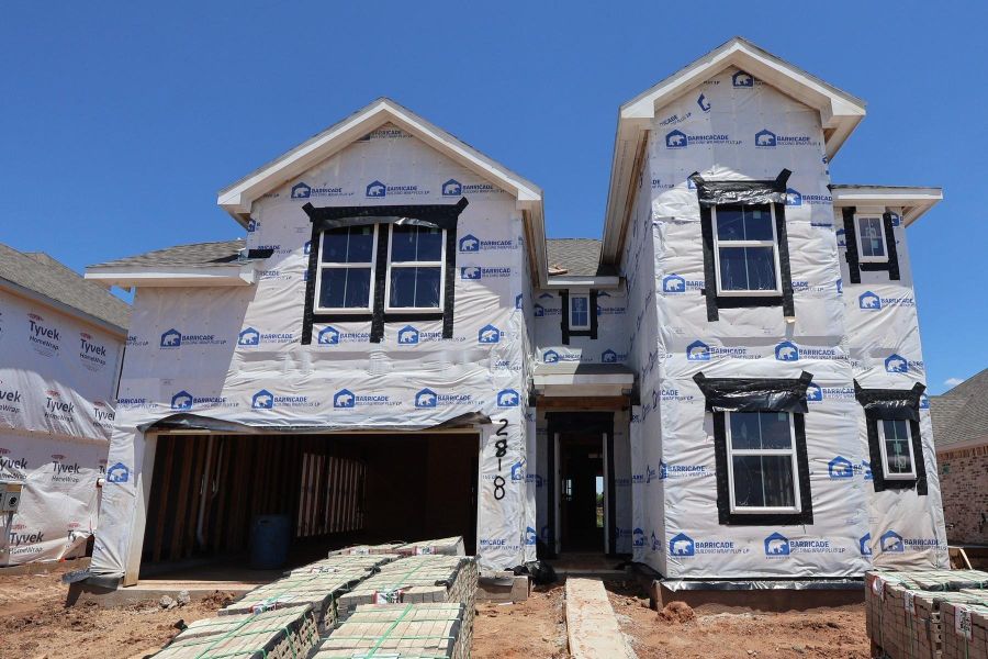 Two story home with 5 beds, 4.5 baths, and 3 car tandem garage