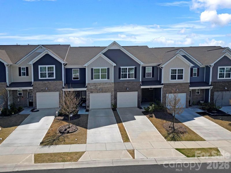 Front exterior of a new home in , Fort Mill, SC, highlighting curb appeal (Image 1). Front exterior of a new home in , Fort Mill, SC, highlighting curb appeal (Image 1).