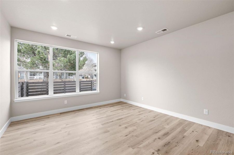 Spacious, unfurnished interior of a new home in Ralston Creek, Arvada (Image 30).
